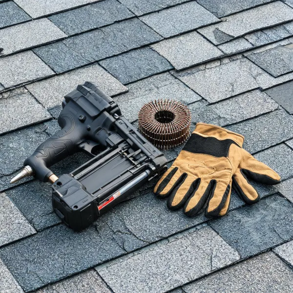 Roofing nailer on shingle sample