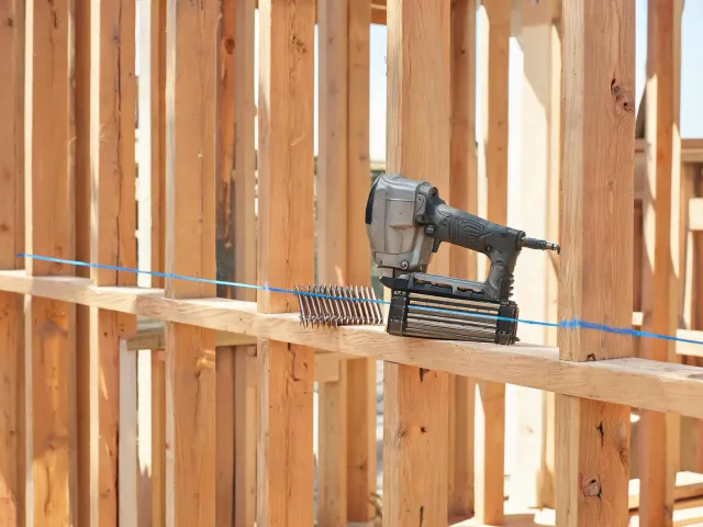 Framing nailer on lumber layout